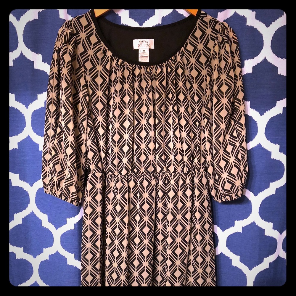 Black and beige flirty dress.